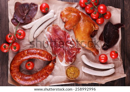 Assortment of deli meats on parchment, closeup