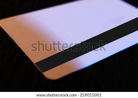 Plastic discount card on dark background