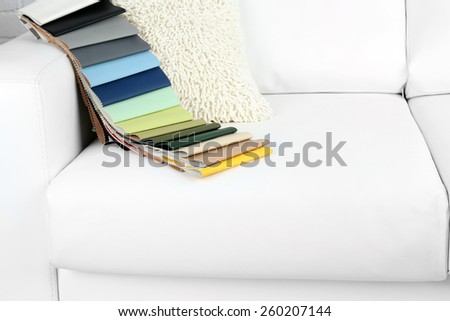 Scraps of colored tissue on sofa close up