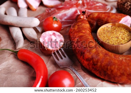 Assortment of deli meats on parchment background, closeup