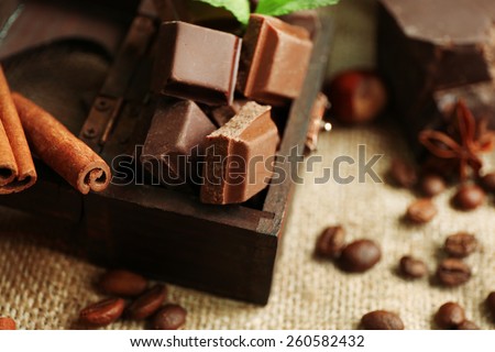 Still life with set of chocolate on burlap cloth, closeup