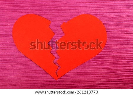Broken heart on colour background