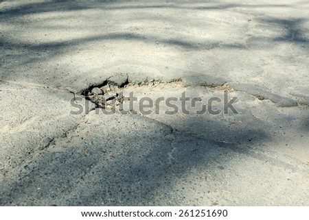 Very bad quality road with potholes