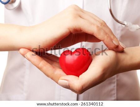 Doctor hands with heart and stethoscope on white background. closeup