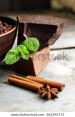 Still life with set of chocolate on wooden background