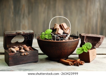 Still life with set of chocolate on wooden background