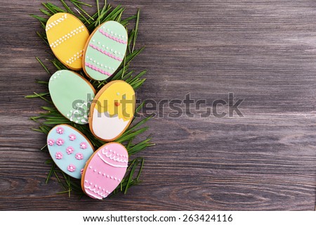 Delicious Easter cookies on wooden background