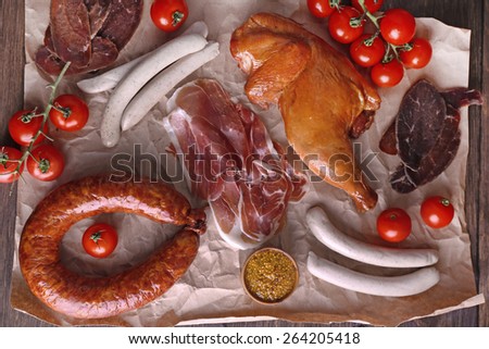 Assortment of deli meats on parchment, top view
