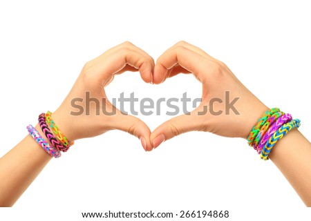 Female hands in shape of heart with bracelets isolated on white