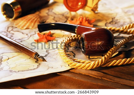 Marine still life with world map on wooden table background