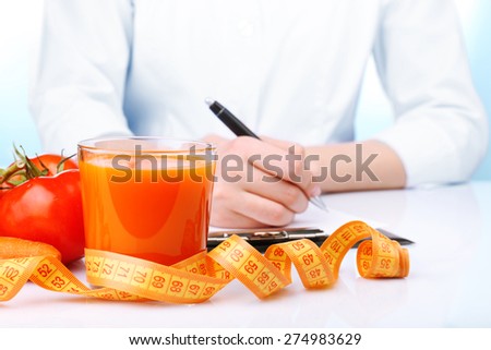 Nutritionist Doctor writing  diet plan in office, closeup