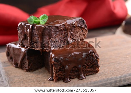 Delicious chocolate cakes on table close-up