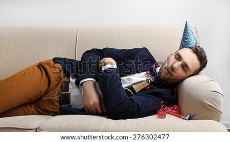Young man on couch after fun close up