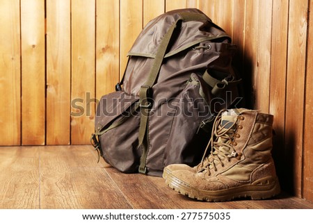 Hunting gear on wooden background
