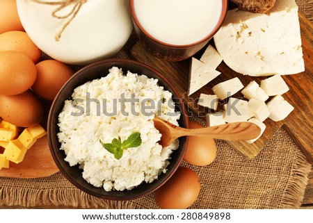 Tasty dairy products on sackcloth background