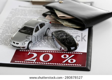 Tablet, purse and toy car isolated on white