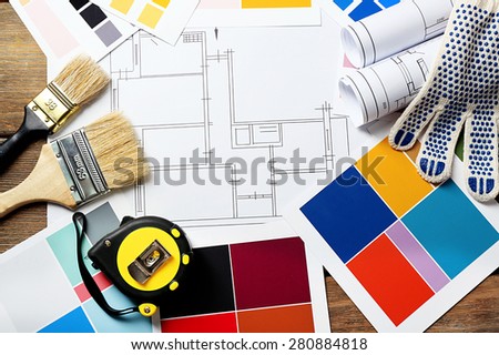 Construction instruments, plan and brushes close-up