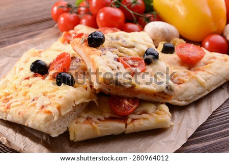 Delicious homemade pizza on table close-up