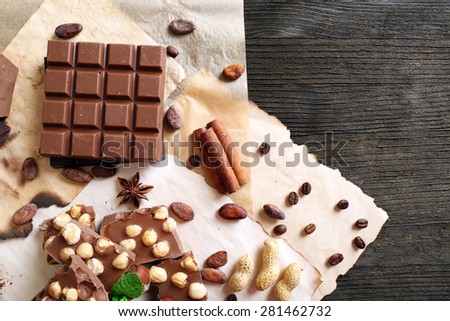 Still life with set of chocolate on table, top view