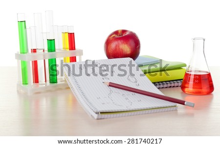Desk with books and test tubes isolated on white