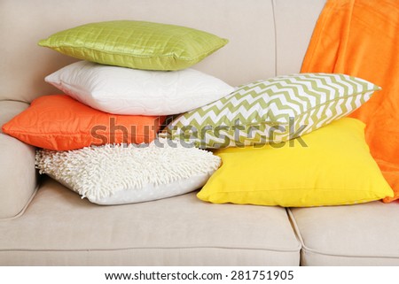 Colorful pillows on sofa close up
