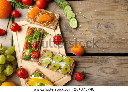 Still life with vegetarian sandwiches on wooden table