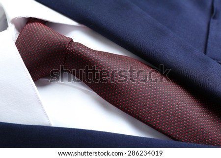 Male jacket with shirt and tie close up