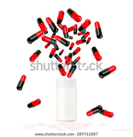 Bright color pills flying away from open plastic bottle isolated on white
