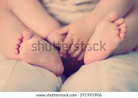 Baby hands and feet, closeup