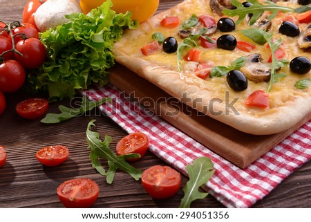 Delicious homemade pizza on table close-up