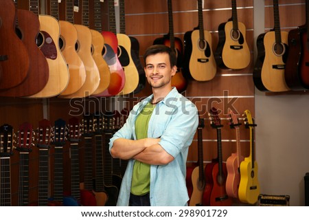 Handsome young man in music store
