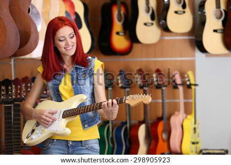 Beautiful young woman in music store
