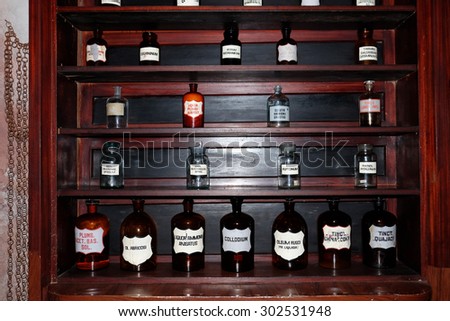 Chemicals and laboratory utensils on shelf