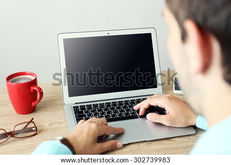 Man working with laptop in office