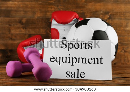 Sport goods for sale, on wooden background