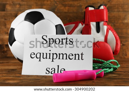 Sport goods for sale, on wooden background