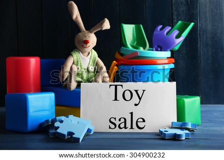 Toys for sale on wooden background