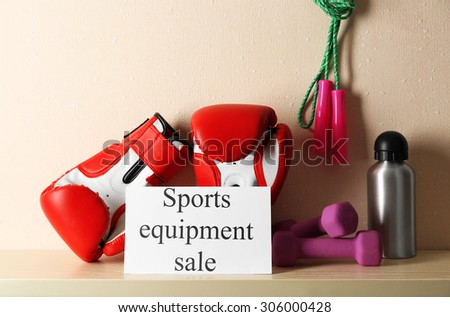 Sport goods for sale, on light wall background
