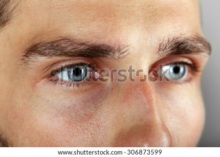 Beautiful blue man eyes close up