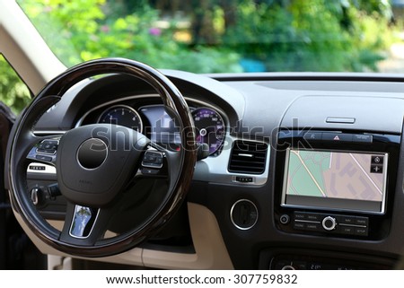 Modern car illuminated dashboard and steering wheel