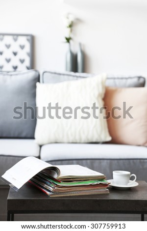 Magazines on table in living room, close up