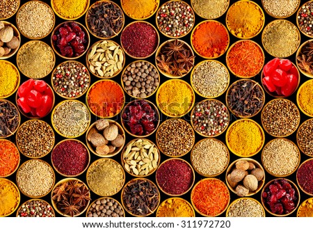 Different spices on black background