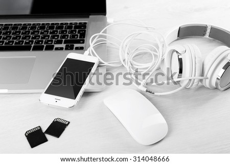 Computer peripherals and laptop accessories on white wooden background