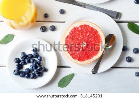 Healthy breakfast with fruits and berries on table close up