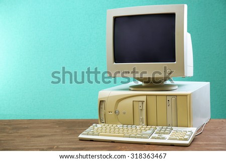 Obsolete computer set on light blue background