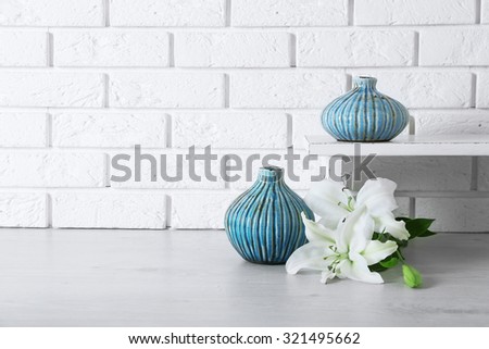 Home decor and flowers on brick wall background