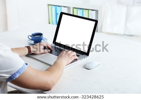 Man working with laptop in office