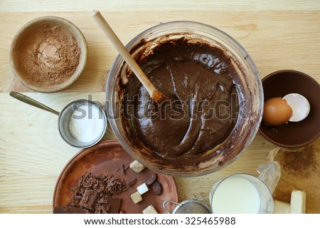 Preparing dough for chocolate pie on table close up