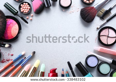 Frame of woman\'s decorative cosmetics on light background