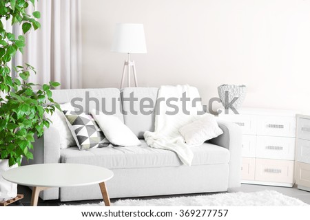 Room interior with sofa, commode and table